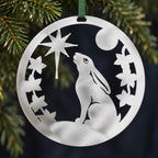 Stainless steel Christmas Hare hanging among understated evergreen Christmas foliage