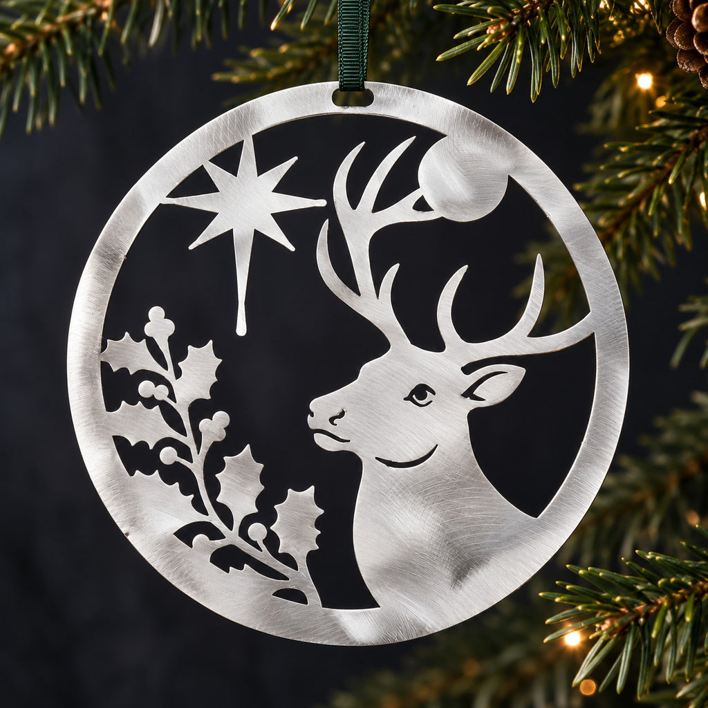 Stainless steel Christmas Stag hanging beside understated evergreen Christmas foliage