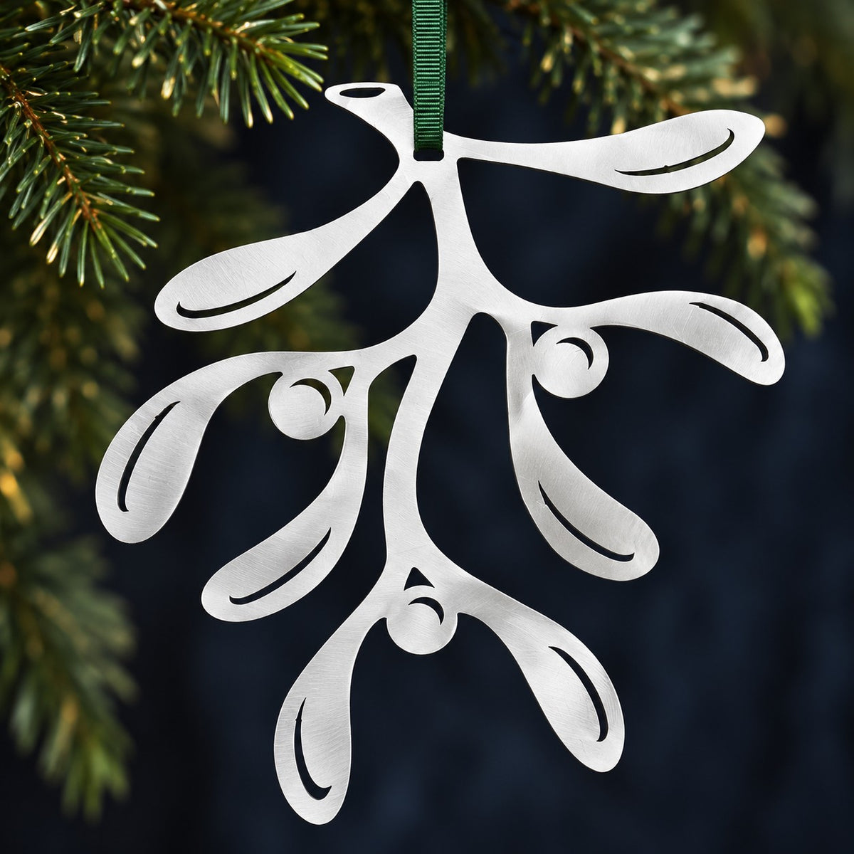 Stainless steel Mistletoe hanging with understated evergreen Christmas foliage