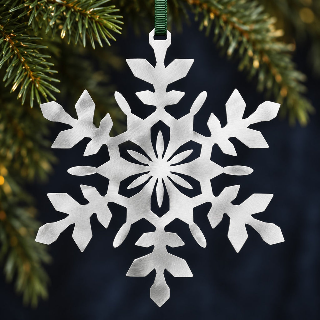 Stainless steel Snowflake hanging with understated evergreen Christmas foliage