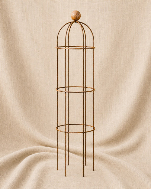 Classic Round Obelisk with Ball Top, handcrafted steel garden obelisk for supporting climbing plants, displayed on a natural hessian background by Dolton Designs.