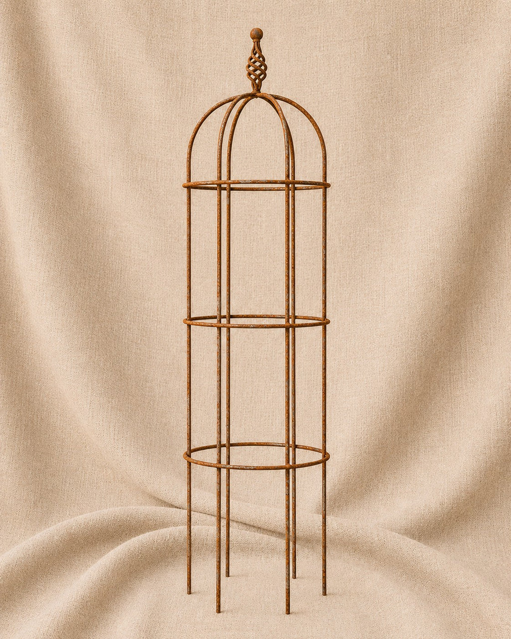 Classic Round Obelisk with Twist Top handcrafted steel garden obelisk by Dolton Designs displayed on a natural hessian background.